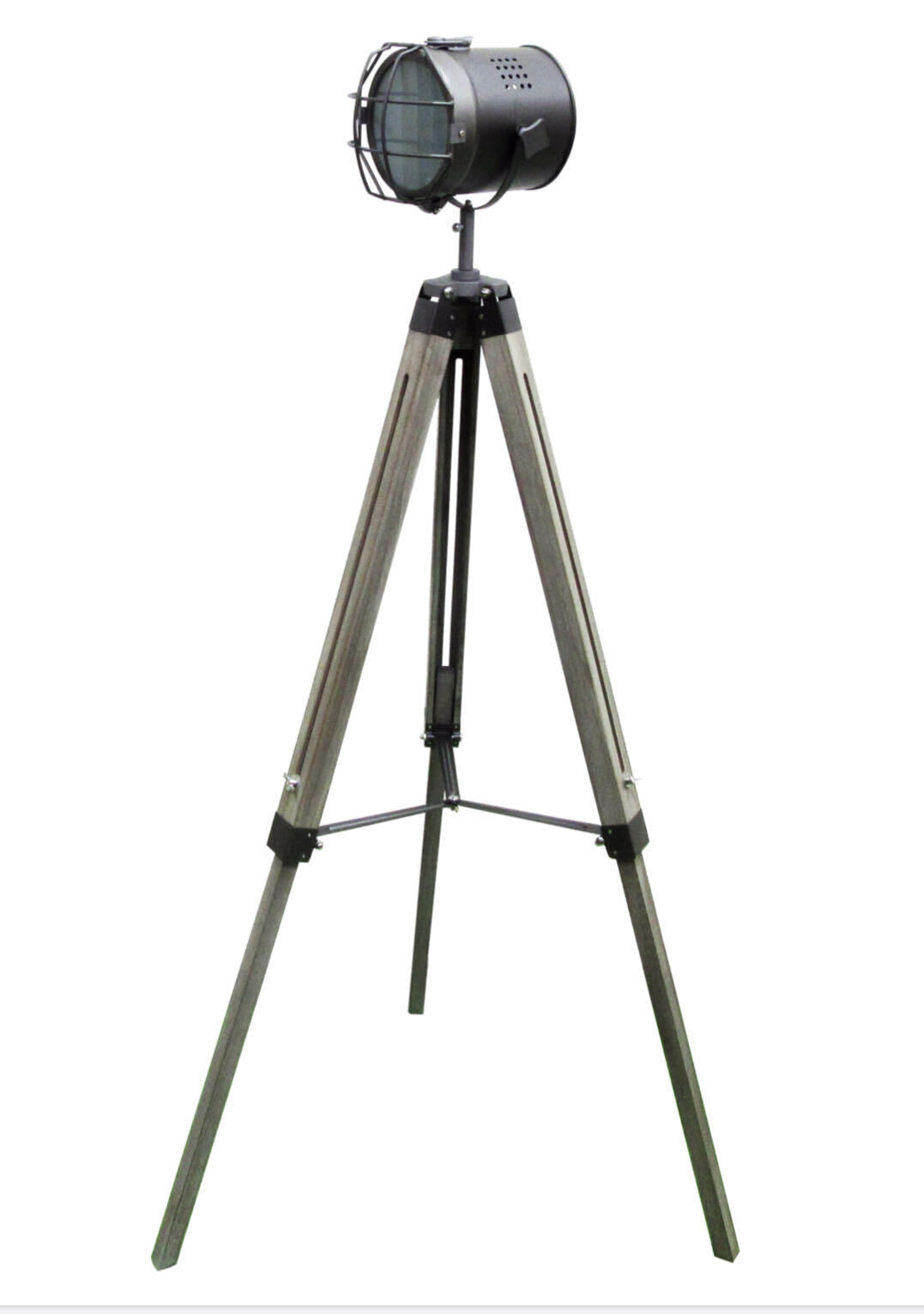 Vintage-style spotlight on a tripod with a white background